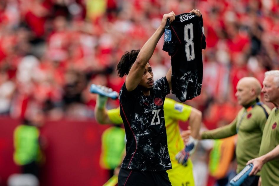 Canada's Nathan-Dylan Saliba lifted the injured Kone's jersey after scoring